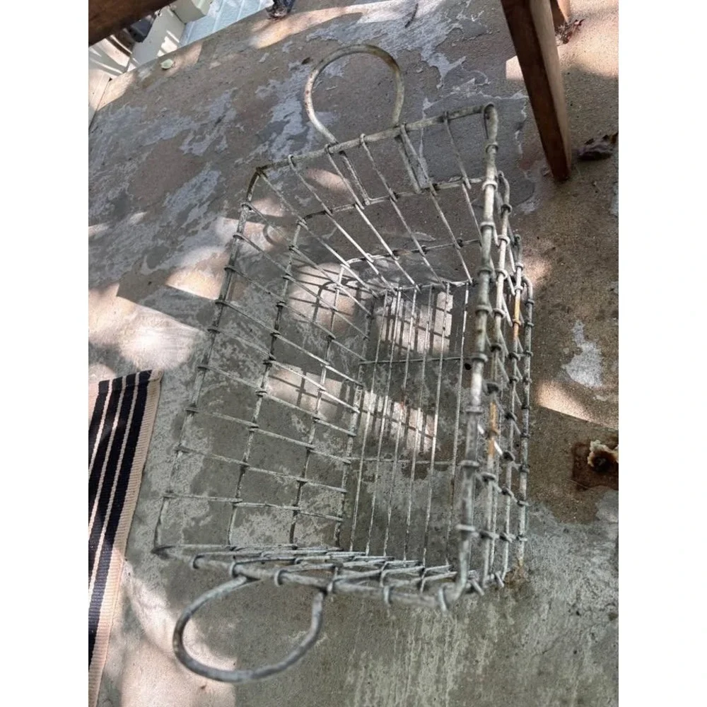 Farmhouse primitive wire basket . Great to hold cookbooks . Very heavy w handles